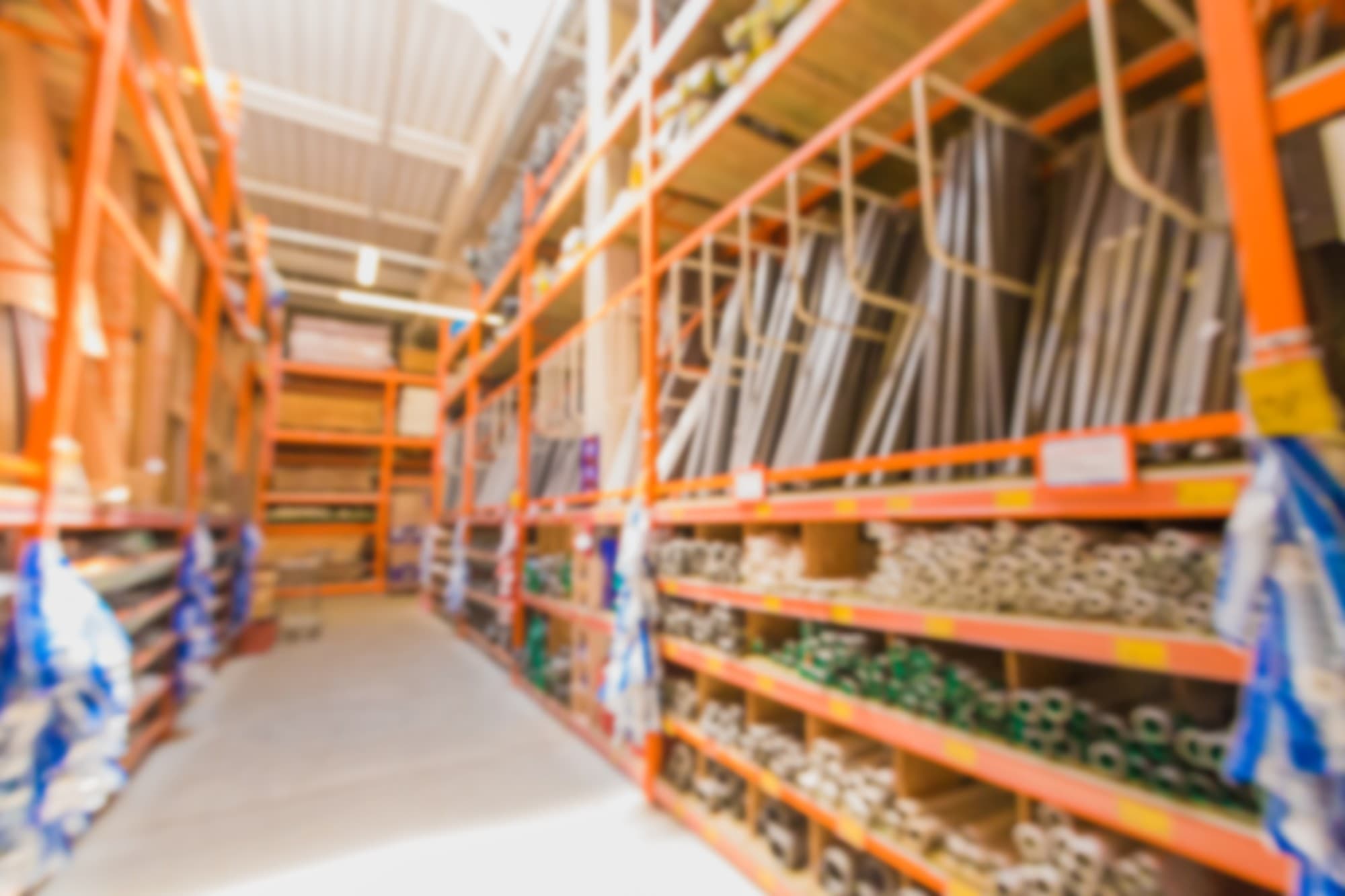 Warehouse construction materials stacked on shelves.