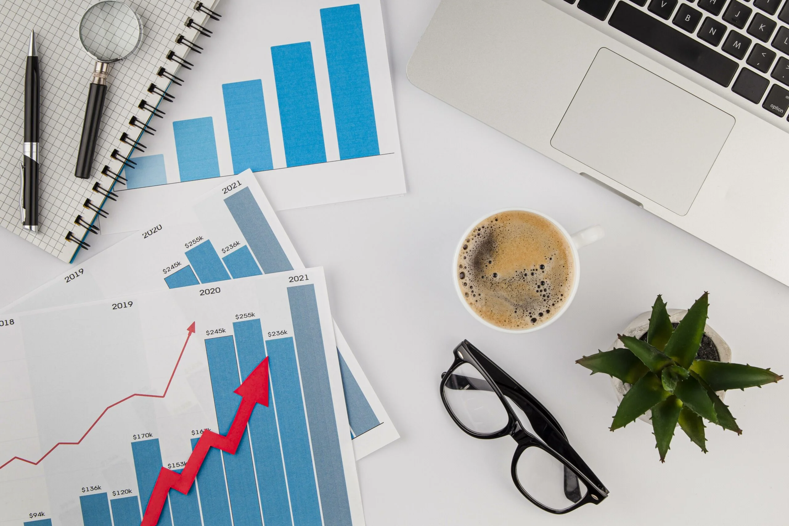top-view-office-desk-with-growth-chart-coffee-with-glasses is utilities expense an asset