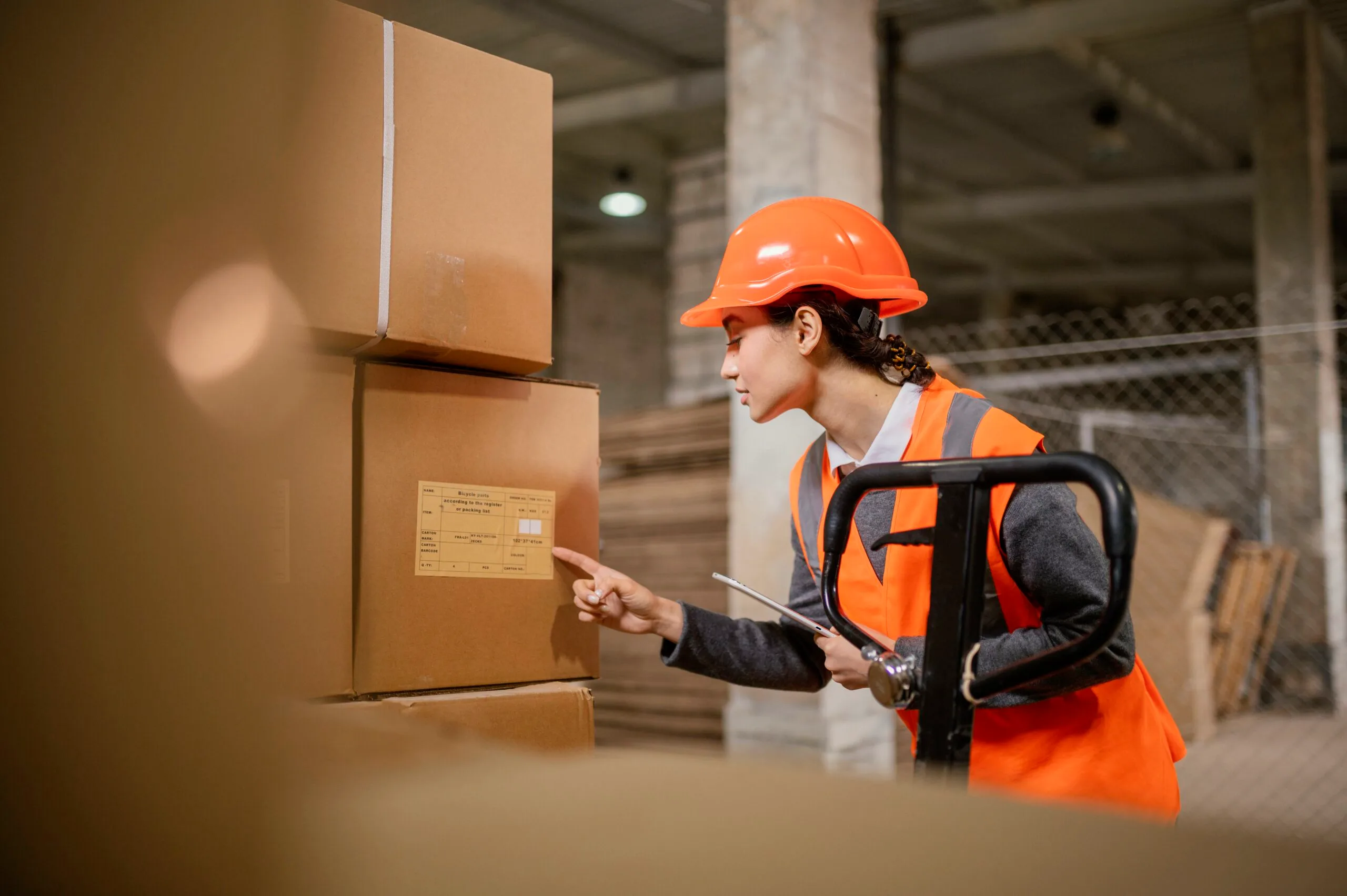 woman-wearing-safety-cap-work Inventory vs Supplies: Key Differences & Tracking Tips