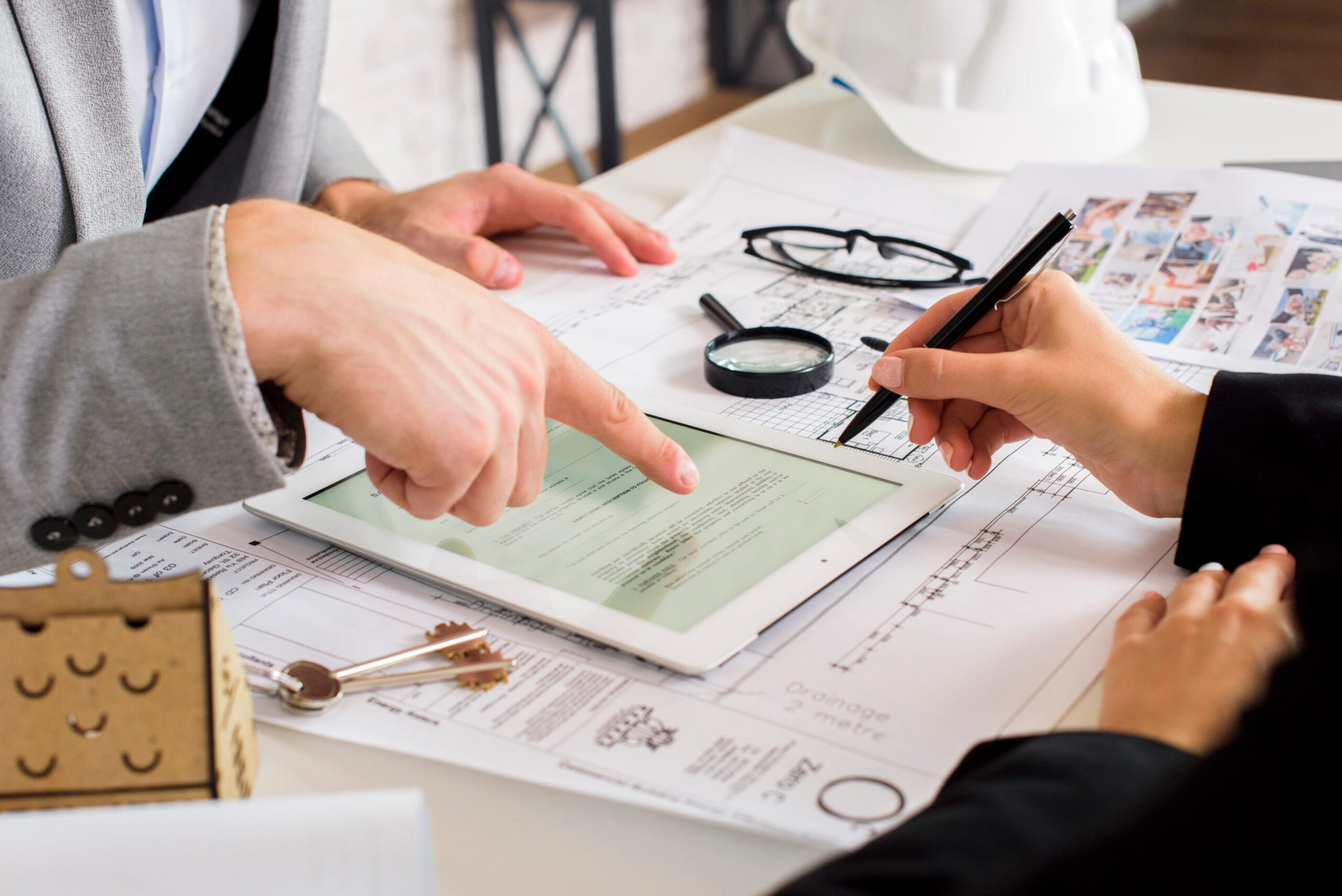 businessmen-analyzing-business-plan-tablet What Is Asset Identification? A Guide to Tracking Your Assets