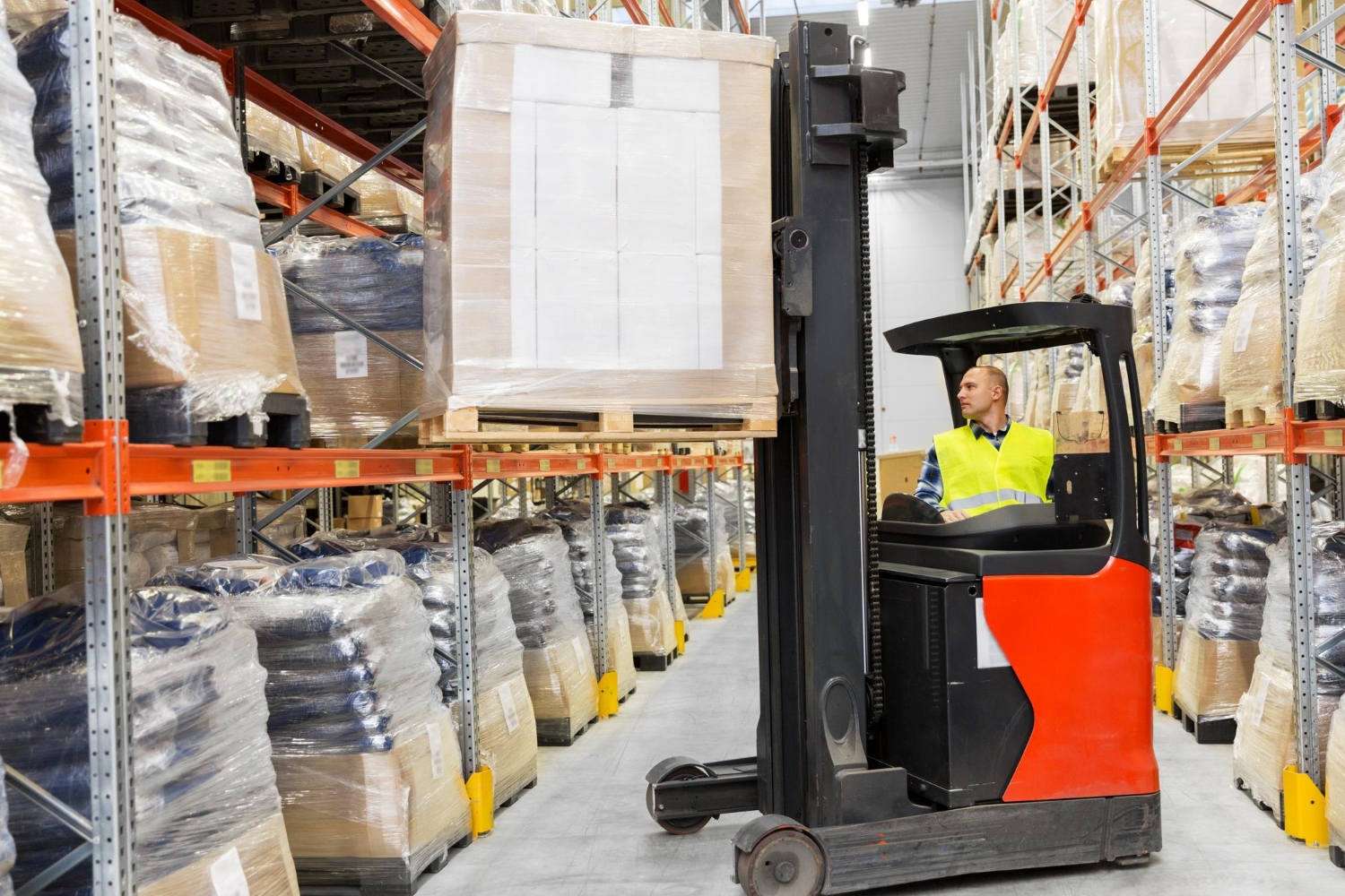 Warehouse worker inspecting lifting equipment, following LOLER regulations Warehouse worker inspecting lifting equipment, following LOLER regulations.